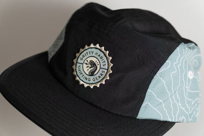 Black cap with a logo on a gray background